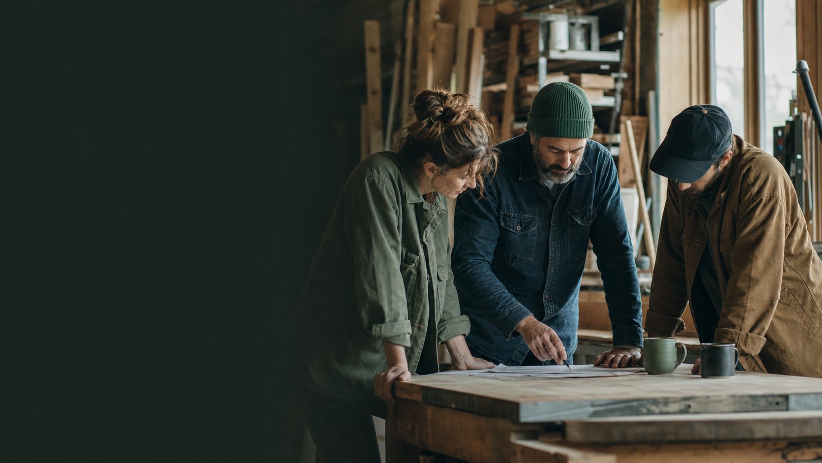 A small-business owner and team reviewing a community partnership plan